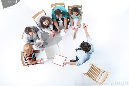 Image of Group of Business People in a Meeting