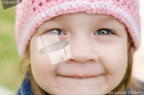 Image of Close-up portrait of a smiling three-year girl