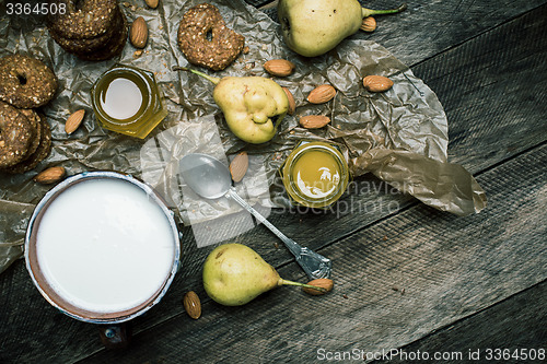 Image of Almonds pears Cookies and cream on rustic wood