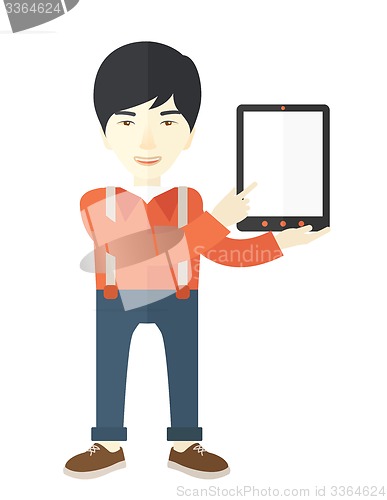 Image of Asian guy holding a digital tablet. 