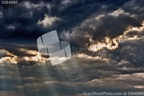 Image of Stormy sky with a dramatic sunbeams