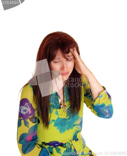 Image of Crying woman with bad headache.