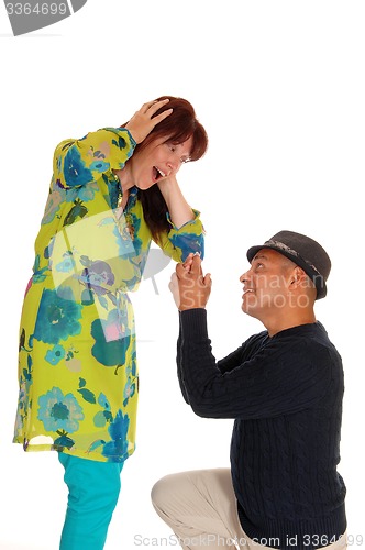 Image of Man proposing to his girlfriend.