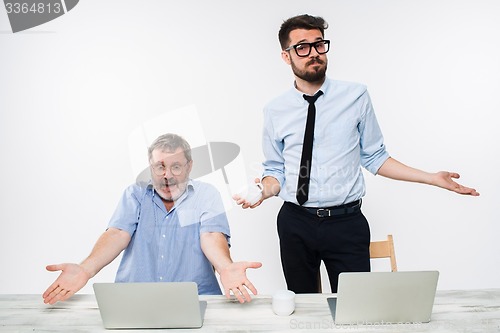 Image of The two colleagues working together at office on white background