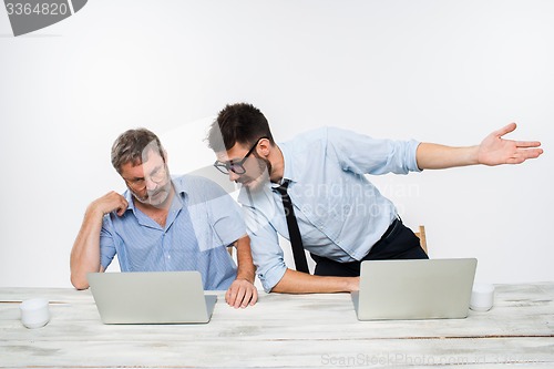 Image of The two colleagues working together at office on white background