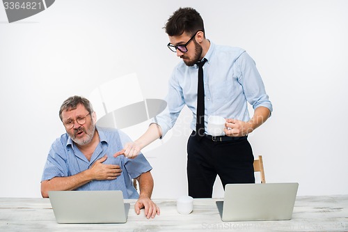 Image of The two colleagues working together at office on white background