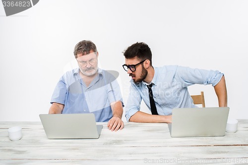 Image of The two colleagues working together at office on white background