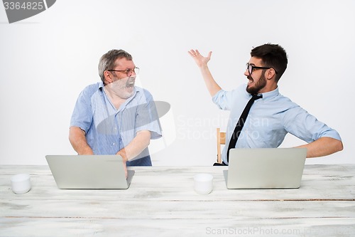 Image of The two colleagues working together at office on white background