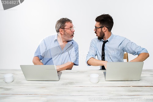 Image of The two colleagues working together at office on white background