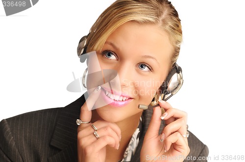 Image of young pretty sexy blond hair operator with headset