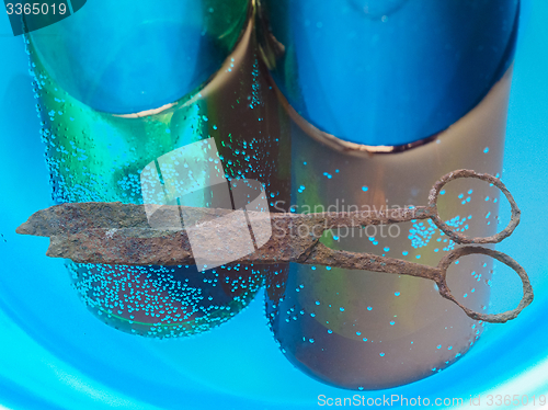 Image of Rusted scissors and bottles