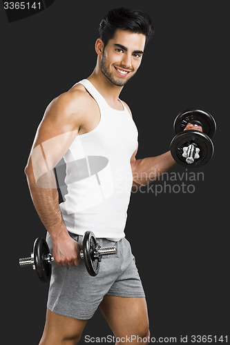 Image of Athletic man lifting weights