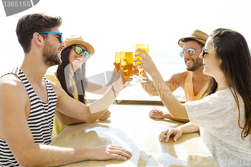 Image of Friends drinking a cold beer