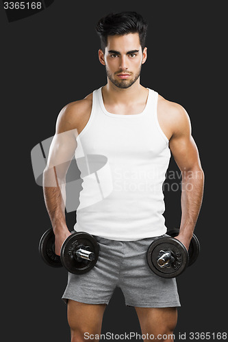 Image of Athletic man lifting weights