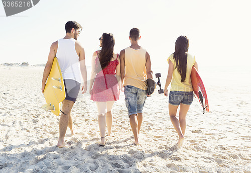 Image of Friends walking at the beach