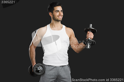 Image of Athletic man lifting weights