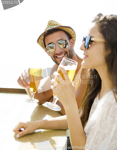 Image of Friends drinking a cold beer