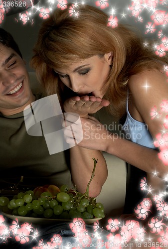 Image of hand that feeds with flowers