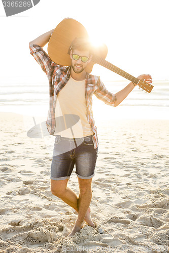 Image of Handsome young man at the beach