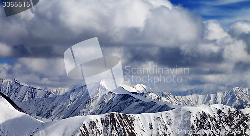 Image of Winter sunlight mountains in clouds