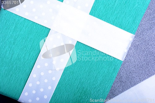 Image of holiday Green gift box with white ribbon