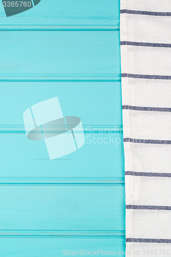 Image of Blue and white towel over table