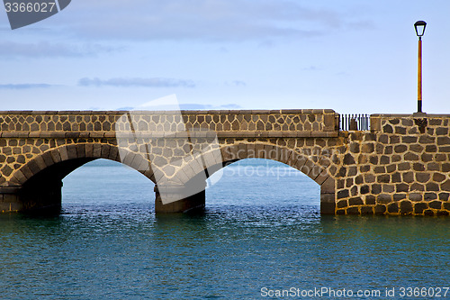 Image of atlantic ocean lanzarote  bridge and in the blue sky    