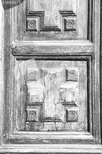 Image of texture of a brown old door in italy europe