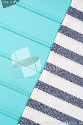 Image of Blue and white towel over table