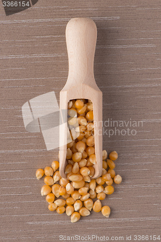 Image of Wooden scoop with corn