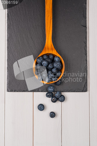 Image of Blueberries on a wooden spoon