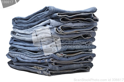 Image of the heap of modern designer blue jeans