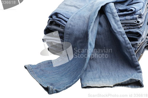 Image of the heap of modern designer blue jeans