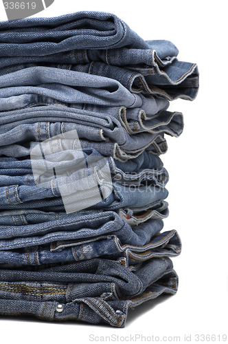 Image of the heap of modern designer blue jeans