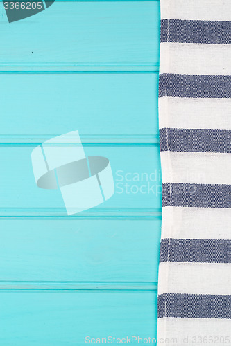 Image of Blue and white towel over table