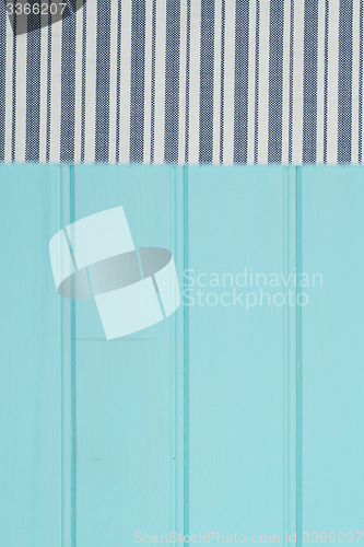 Image of Blue and white towel over table