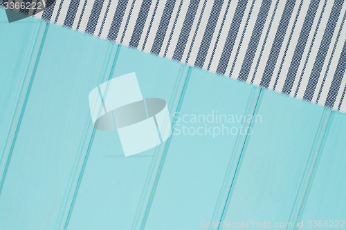 Image of Blue and white towel over table