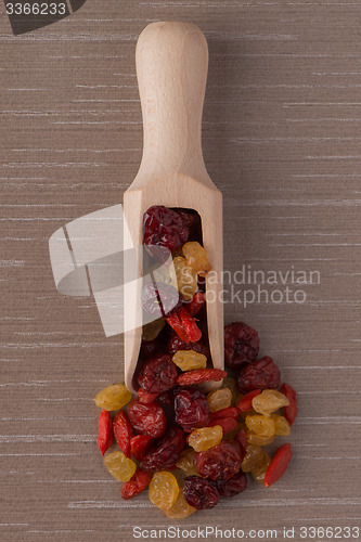 Image of Wooden scoop with mixed dried fruits