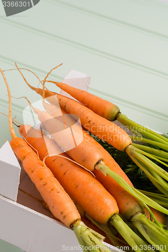 Image of Carrots on wooden table