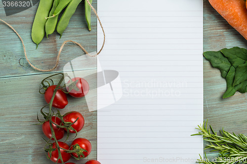 Image of White paper and vegetables