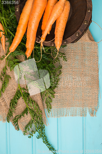 Image of Carrots on a wooden table