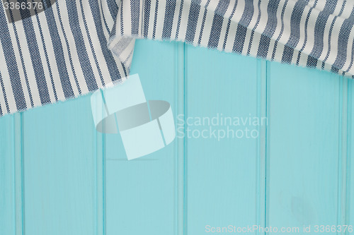 Image of Blue and white towel over table