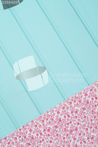Image of Pink towel over wooden table