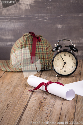 Image of Wrapped paper sheets and magnifying glass