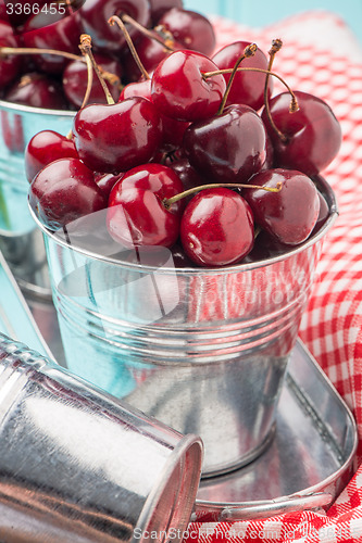 Image of Cherries in blue wooden table