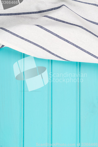 Image of Blue and white towel over table