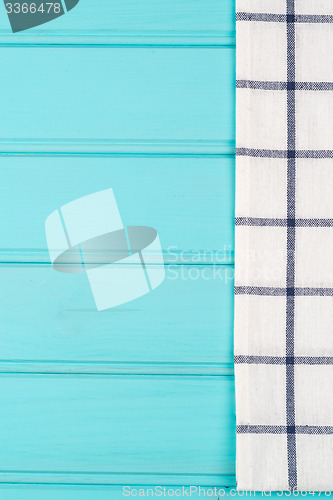 Image of Blue and white towel over table