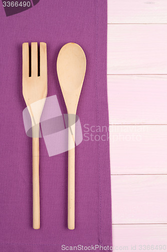 Image of Kitchenware on purple towel