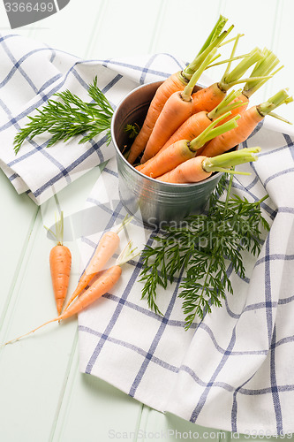 Image of Carrots on wooden table