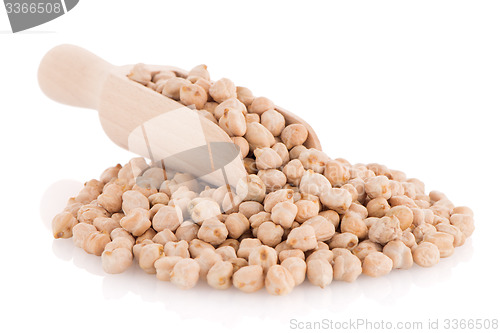 Image of Uncooked chickpeas and wooden scoop